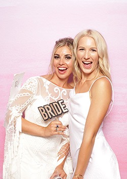 creative booth bride smiling in photo booth